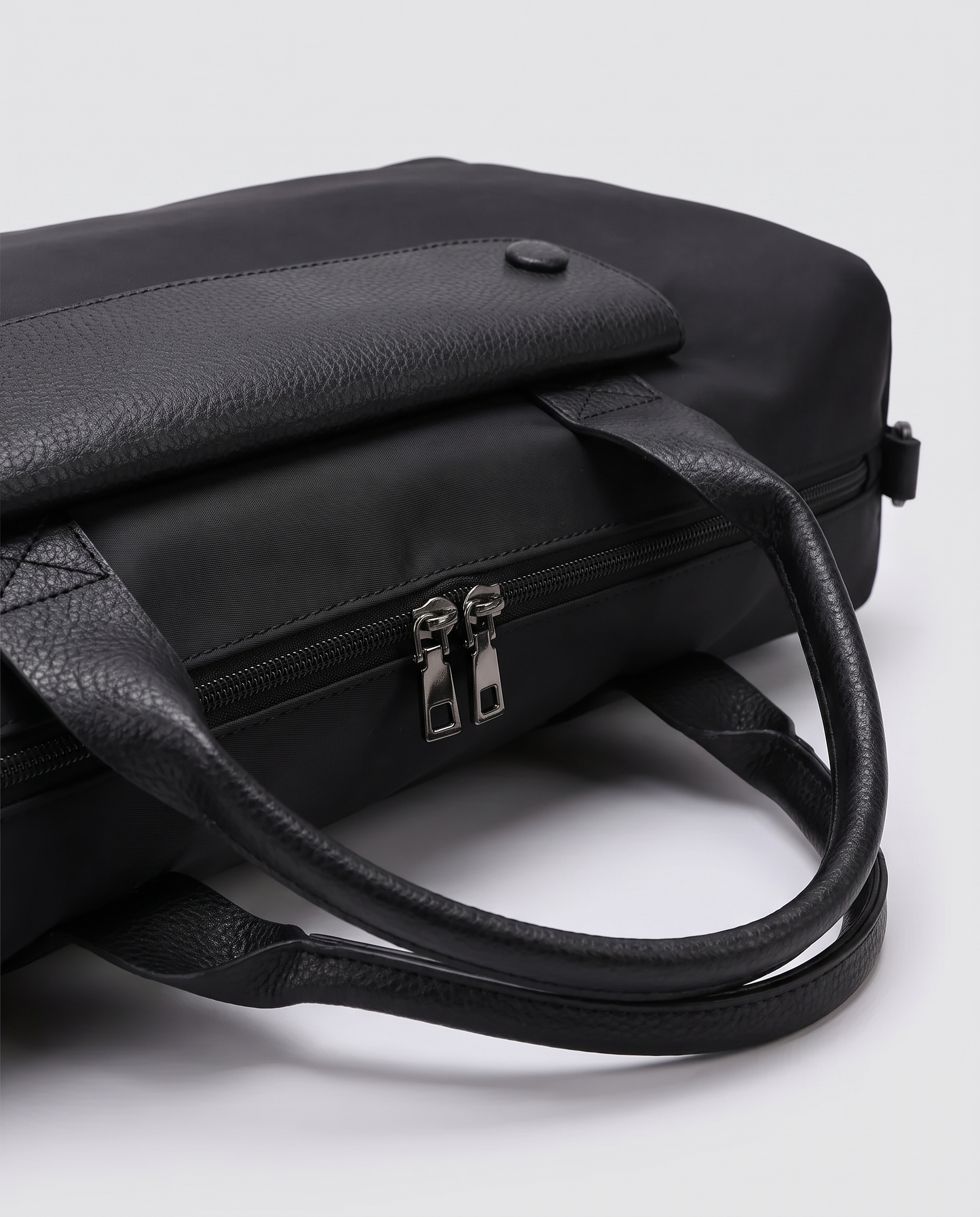 Montrave Sport Duffel black hardware detail studio shot